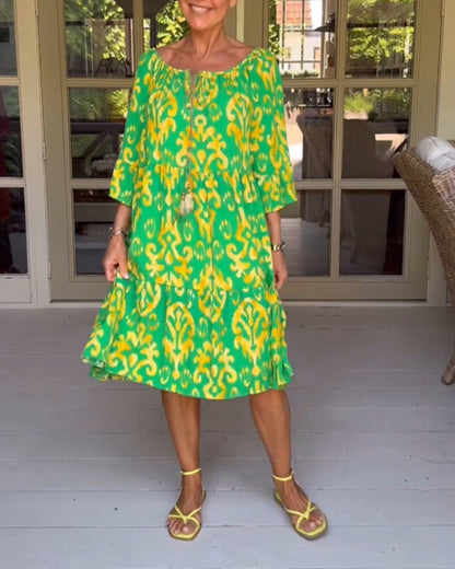 Red dress with print and three-quarter sleeves