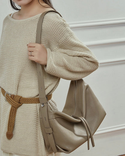 Women's Genuine Pebbled Leather Crescent Bag with Tassel Accent