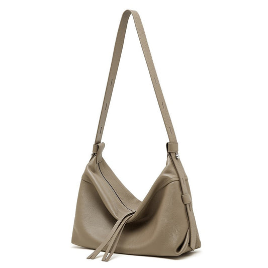 Women's Genuine Pebbled Leather Crescent Bag with Tassel Accent