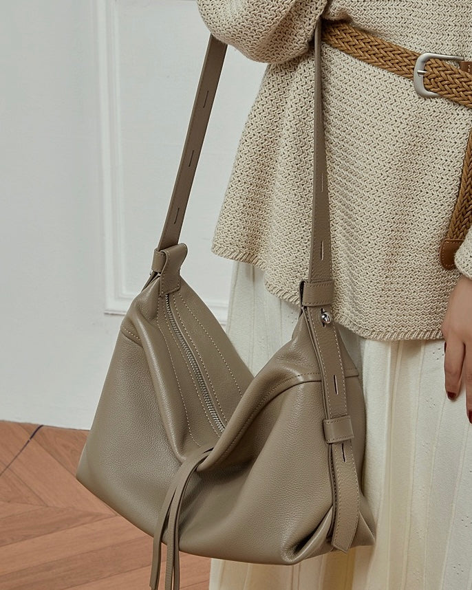 Women's Genuine Pebbled Leather Crescent Bag with Tassel Accent