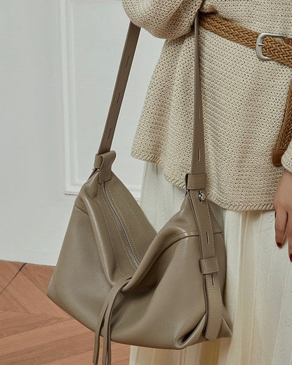 Women's Genuine Pebbled Leather Crescent Bag with Tassel Accent