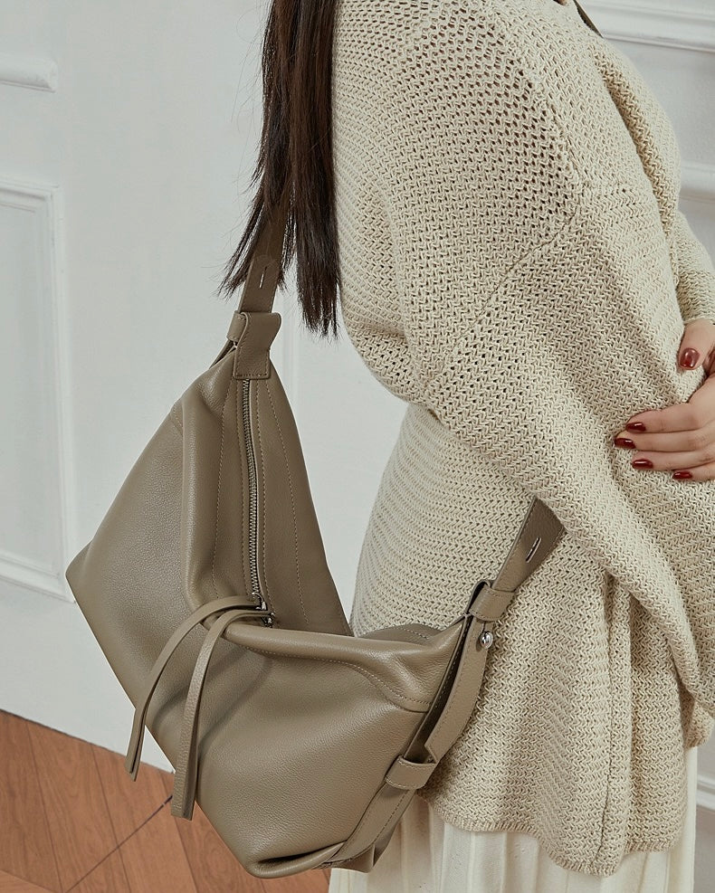 Women's Genuine Pebbled Leather Crescent Bag with Tassel Accent