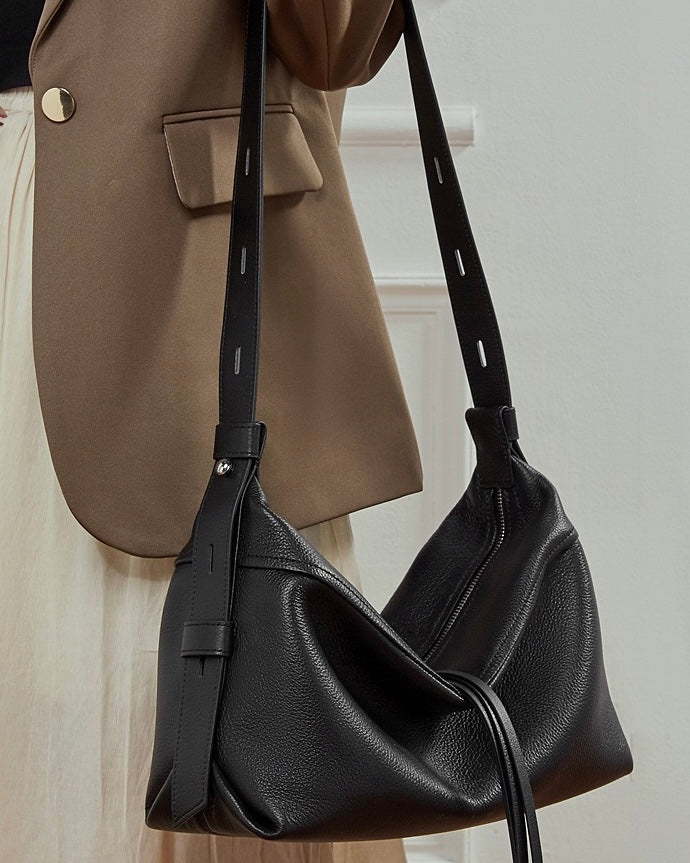 Women's Genuine Pebbled Leather Crescent Bag with Tassel Accent